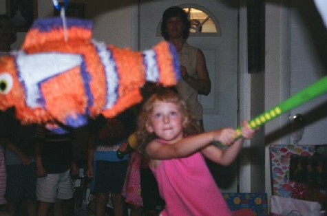 Daddy held this neat pinata so we could all get candy.