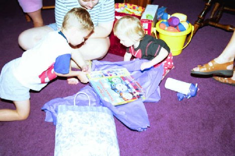 Me and my friend Michael with Uncle Glenn's present, I guess he wants me TRAINed early.