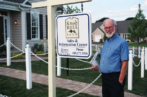 Glenn standing by Knob Hill Office sign.