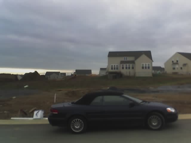 Car in front of driveway