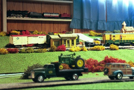 Several model trains and farm equipment.