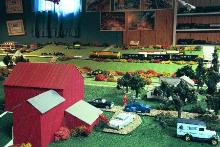 Another view of Ritters farm, this one with a freight train in the background.