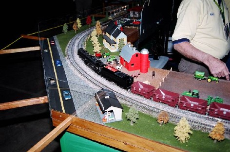 A 75 car SHS ore train headed by a River Raisen Allegheny enters the new NPSG corners.