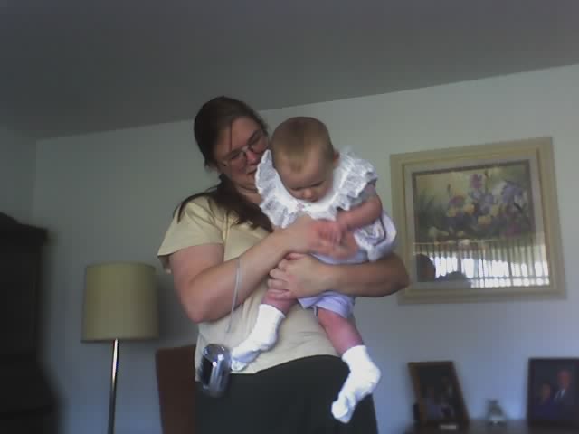 I TRY TO WIGGLE OUT OF MOMMY'S ARMS