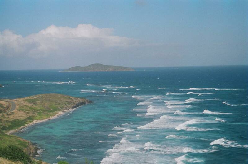 ROUGH SURF OFF POINT UDALL, BUCK ISLAND IN DISTANCE